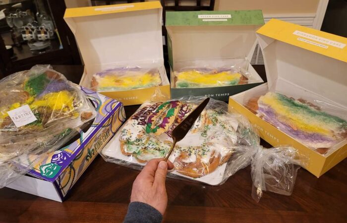 A variety of New Orleans King Cakes from different bakeries including Manny Randazzo, Tartine, and Bon Temps, illustrating brand loyalty and Team Randazzo vs Team Dong Phuong debates during Carnival season.