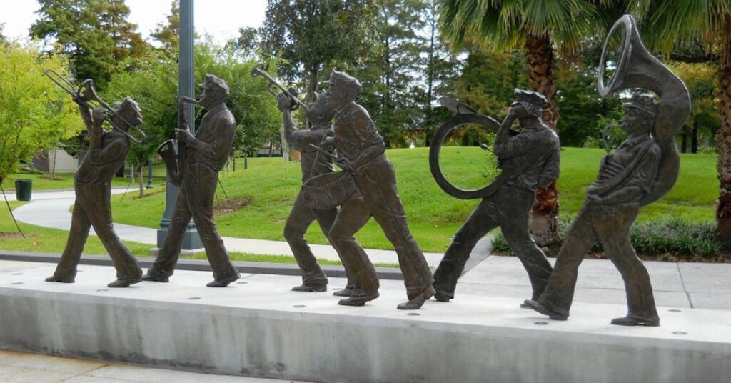 Bronze statues of a New Orleans second line brass band marching in formation